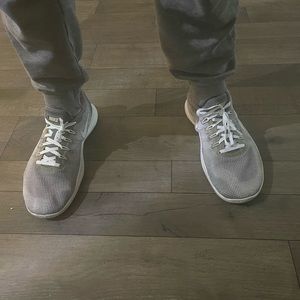 Gently work Nike running shoes with many miles of wear left